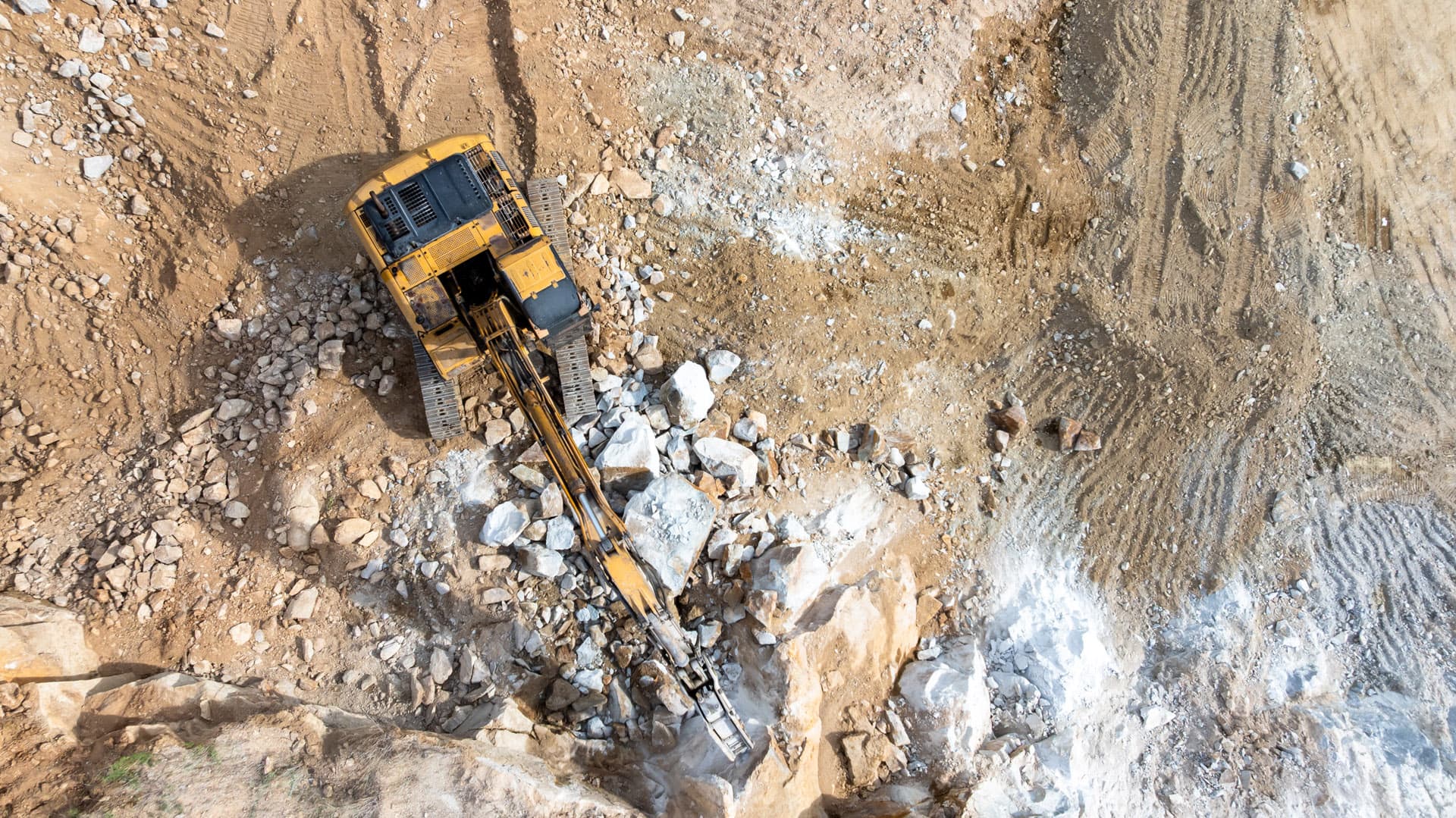 Active exploration site showing modern mining equipment and techniques